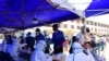 People queue to be tested for the COVID-19 coronavirus in Lhasa, in China's western Tibet Autonomous Region, Aug. 9, 2022.