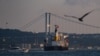 The Panama-flagged bulk carrier Navi Star carrying tons of grain from Ukraine sails along the Bosphorus Strait past Istanbul on Aug. 7, 2022, after being officially inspected. 
