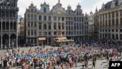 Participants take part of a ceremony at the Grand-Place in Brussels to celebrate Ukraine's Independence Day on Aug. 24, 2022.