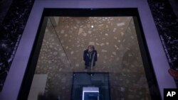 Satoshi Hama, a member of the artistic collective Dumb Type, is seen through a hole in the floor of the Japanese pavilion at the 59th Venice Biennale Of The Arts in Venice, Italy, April 21, 2022.