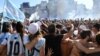 Fans celebrate their team's win at the World Cup, in central Buenos Aires, Argentina, Dec. 18, 2022.