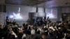 Officials of ispace Inc's HAKUTO-R mission look at live broadcasting of the launch of a SpaceX Falcon 9 rocket for ispace at Cape Canaveral Space Force Station, in Tokyo, Dec. 11, 2022. (Kyodo via Reuters)