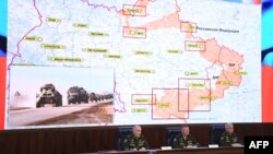 Russian officials hold a briefing on Russian military action in Ukraine, in Moscow on March 25, 2022. The screen shows the map of Ukraine.