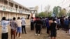 မြန်မာထဲက အွန်လိုင်းငွေလိမ်ဂိုဏ်းတွေမှာ လူကုန်းကူးအဓ္မခိုင်းစေခံခဲ့ရသူများကို ကယ်ဆယ်အပြီး ထိုင်းနိုင်ငံဘက်က ယာယီစခန်းတခုမှာ တွေ့ရစဉ် (ဖေဖော်ဝါရီ ၁၂၊ ၂၀၂၅)