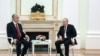 FILE - Russian President Vladimir Putin and Kazakh President Kassym-Jomart Tokayev attend a meeting on the sidelines of the Collective Security Treaty Organization (CSTO) summit at the Kremlin, May 16, 2022. (Sputnik/Anton Novoderezhkin/Pool via Reuters)