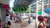 Empat orang yang terluka akibat pemboman di sebuah halte bus tampak tergeletak di sisi jalan di pusat kota Yangon, Myanmar Selasa (31/5). 