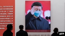 Poster Presiden China Xi Jinping di sebuah pameran di China. (Foto: AFP)