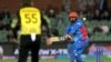 FILE - Afghanistan's Captain Mohammad Nabi plays a shot in the air during the ICC men's Twenty20 World Cup 2022 cricket match between Australia and Afghanistan at Adelaide Oval, in Adelaide, Nov. 4, 2022.