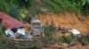 Rescue teams continue the search for victims caught in a landslide in Batang Kali, Malaysia, Dec. 17, 2022.
