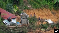 Rescue teams continue the search for victims caught in a landslide in Batang Kali, Malaysia, Dec. 17, 2022.