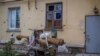 Belongings are collected on a trolley put near a house damaged by Russian shelling, in Siversk, Donetsk region, Ukraine, Nov. 6, 2022.