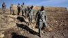 FILE - U.S. Army soldiers tour St. Elijah's Monastery on Forward Operating Base Marez in Mosul, Iraq.