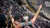 Race fans cheer the start of a NASCAR auto race in Bristol, Tennessee, Sept. 17, 2022.