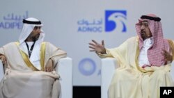 UAE Energy Minister Suhail al-Mazrouei, left, listens to Khalid al-Falih, Saudi Energy and Oil Minister, in the opening ceremony of the Abu Dhabi International Exhibition & Conference, ADIPEC, in Abu Dhabi, United Arab Emirates, Nov.12, 2018.