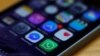 FILE - A WhatsApp icon (bottom, center) is seen on an iPhone in this March 27, 2017, illustration photo.