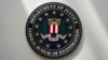 FILE - An FBI seal is seen on a wall in Omaha, Nebraska, Aug. 10, 2022.