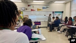 FILE - Emmitt Glynn teaches AP African American studies to a group of Baton Rouge Magnet High School students on Monday, Jan. 30, 2023 in Baton Rouge, La. (AP Photo/Stephen Smith)