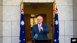 Perdana Menteri Australia Scott Morrison saat konferensi pers di Gedung Parlemen di Canberra, Australia, Minggu, 10 April 2022. (Foto: via AP)