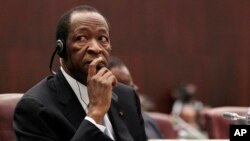 FILE - Burkina Faso President Blaise Compaore listens at the Sipopo conference center, outside Malabo, Equatorial Guinea, June 29, 2011.