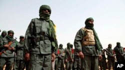 Malian troops join with former rebels before a joint patrol in Gao, Mali, Feb. 23, 2017. Gao has been a target of attacks by Islamic extremists, including one in January that killed 54.