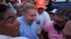 FILE - Venezuelan presidential candidate Edmundo González Urrutia is led out at the end of a campaign rally, in Guatire, Venezuela, May 31, 2024. 