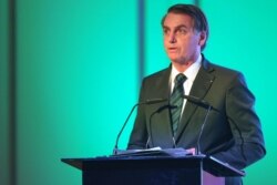 Brazilian President Jair Bolsonaro speaks during the Brazil-United Arab Emirates Business Forum in the Emirati capital Abu Dhabi, Oct. 27, 2019.