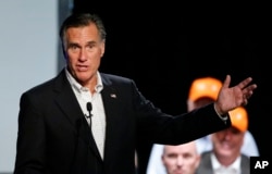 Former Republican presidential nominee Mitt Romney introduces Republican U.S. Rep. Mia Love, of Utah, during a campaign rally, Aug. 24, 2018, in Lehi, Utah.