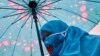 FILE - A woman from China's Uyghur Muslim ethnic group takes part in a demonstration to protest China's treatment of the minority, in Istanbul, Turkey, March 8, 2022.