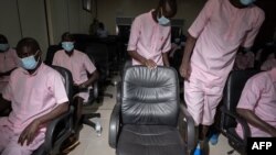 An empty chair where Paul Rusesabagina, the "Hotel Rwanda" hero, who is absent from the verdict as he has been boycotting the procedure, is seen as as the accused sit at the Court of Appeal, Kigali, Rwanda.