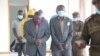 FILE - Some of the 12 people who were sentenced with Thomas Muhosha in connection with the murder of an albino man are seen in court in Malawi, in June 2022. (Lameck Masina/VOA)
