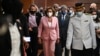This handout photo taken and released by Malaysia’s Department of Information, U.S. House Speaker Nancy Pelosi, center, tours the parliament house in Kuala Lumpur, Aug. 2, 2022. Pelosi arrived in Malaysia on Tuesday for the second leg of an Asian tour.