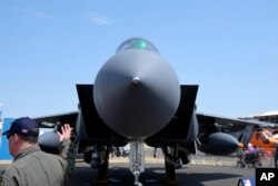 FILE: A F-15E Strike Eagle fighter jet is on display at the Farnborough Air Show fair in Farnborough, England, July 18, 2022.