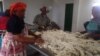 FILE - Local men and women who own livestock are preparing sheep hair to sell to wool manufacturers, in Xhosa village, Eastern Cape, South Africa, Sept. 19, 2017. (Sive Mbali/Wikimedia Commons)