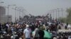 Protesters gather a bridge leading to the Green Zone area in Baghdad, Iraq, Saturday, July 30, 2022 — days after hundreds breached Baghdad's parliament Wednesday chanting anti-Iran curses in a demonstration against a nominee for prime minister by Iran-backed parties.
