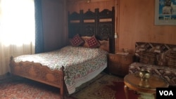 A bedroom inside a houseboat on Kashmir's Nigeen Lake. (Bilal Hussain/VOA)