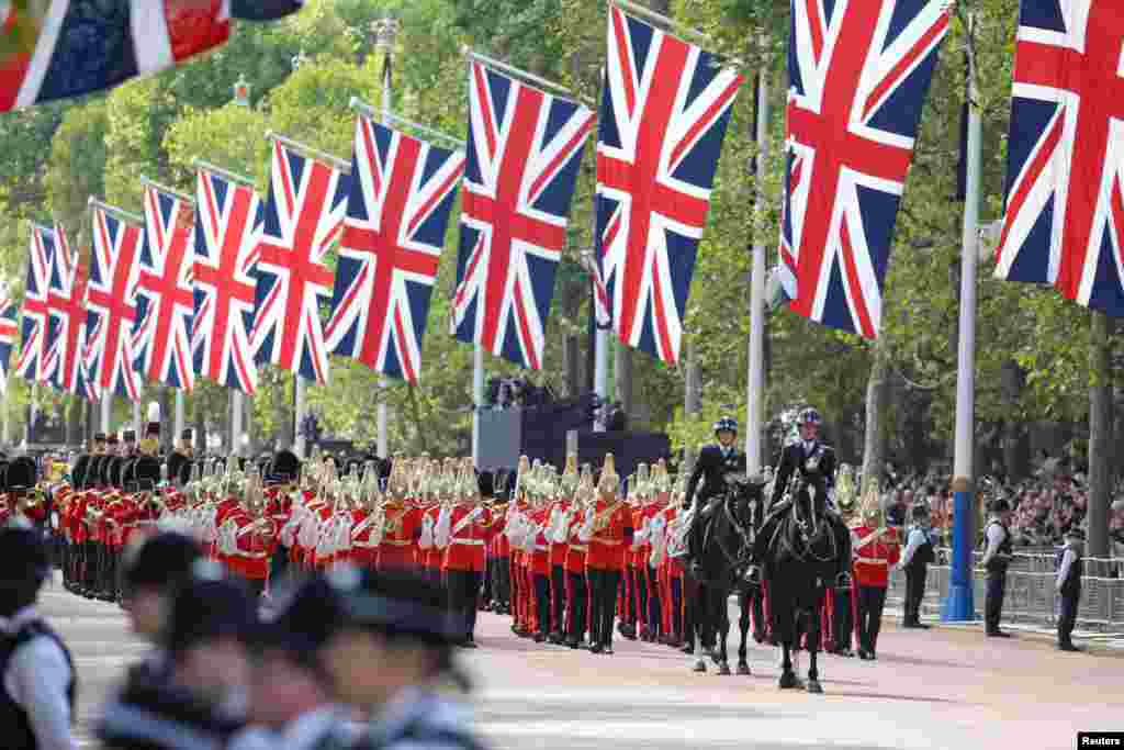 Royal guards march on the day the coffin of Britain's Queen Elizabeth II is transported from Buckingham Palace to Westminster Hall in London, Sept. 14, 2022.