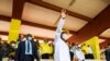 Guinea's outgoing president and presidential candidate Alpha Conde, leader of Rally for the People of Guinea (RPG) waves to supporters as he attends his closing campaign rally ahead of the presidential election in Conakre, Guinea, Oct. 16, 2020.
