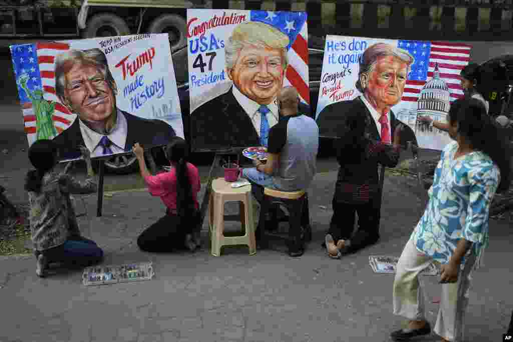Students of Gurukul School of Art paint portraits of U.S. President-elect Donald Trump in Mumbai, India, Nov. 6, 2024.