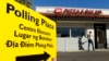 A voter arrives to cast ballots at a local restaurant being used as a polling station in California November 2, 2010. The signboard has translations in Spanish, Tagalog and Vietnamese.