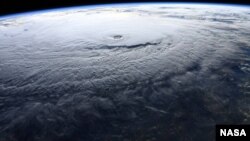 NASA astronaut Ricky Arnold photographs Hurricane Lane near Hawaii in the Pacific Ocean during a flyover from the International Space Station, Aug. 22, 2018.