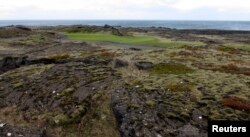Volcanic rocks are seen at the Golfklubberinn Oddur golf course, near Rekyavik, June 5, 2013. The lava beds dominate the rough on many courses, and the beds are filled with crevices that swallow mis-hit golf balls.