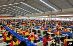FILE - Ethiopian factory workers make shoes at Chinese company Huajian’s plant in Addis Ababa, Ethiopia, Jan. 5, 2017.