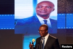 FILE - Emmanuel Ramazani Shadary, Congolese Presidential candidate for the ruling Common Front of Congo (FCC) coalition, announces his political manifesto in Kinshasa, Democratic Republic of Congo, Nov. 19, 2018.