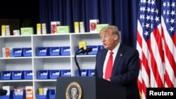 FILE - U.S. President Donald Trump speaks prior to signing executive orders on lowering drug prices in the Eisenhower Executive Office Building at the White House in Washington, July 24, 2020.