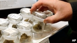 Different strains of marijuana are displayed for sale at the Warmland Centre, a medical marijuana dispensary in Mill Bay, British Columbia on Vancouver Island in Canada, Sept. 24, 2018. 