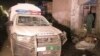 A damaged police vehicle is see after a remote-controlled bomb blast in Pakistan-Afghanistan border town of Chaman, Pakistan, March 23, 2021. 