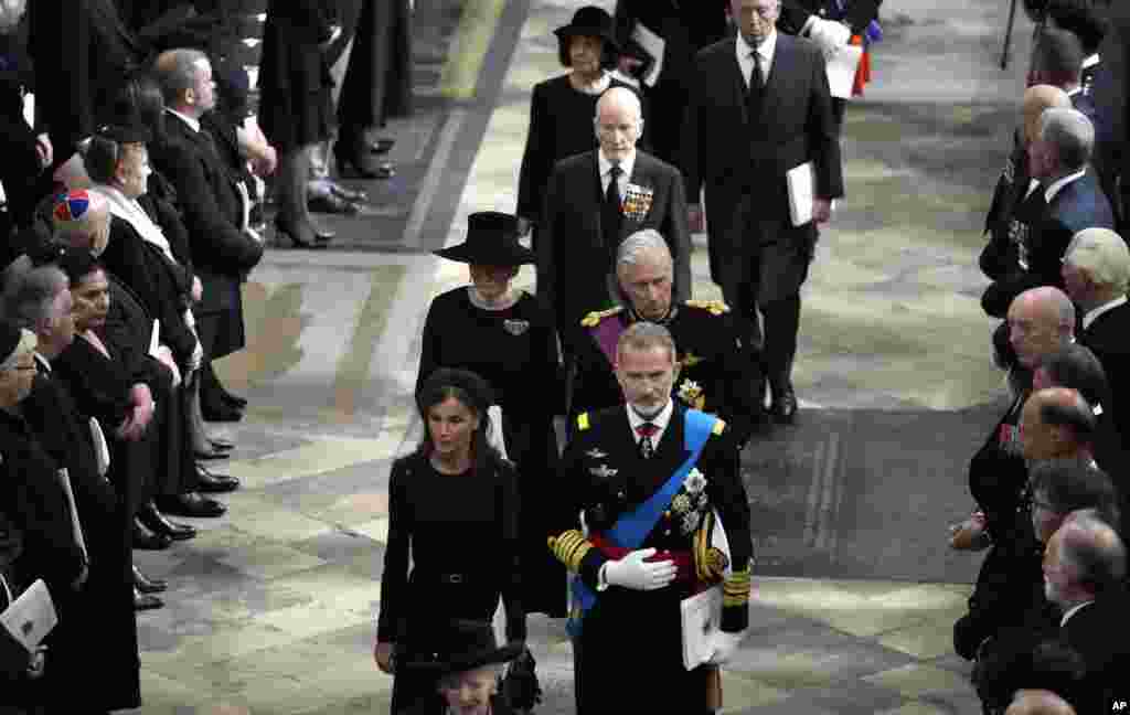 Spain&#39;s King Felipe VI, front right, and Queen Letizia, front left, walk with Belgium&#39;s King Philippe and Queen Mathilde following during the State Funeral of Queen Elizabeth II at Westminster Abbey in central London, Sept. 19, 2022.