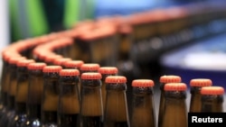 Beer bottles are pictured at the processing line of the newly inaugurated Dashen brewery plant in Debre Birhan town northeast of Ethiopia's capital Addis Ababa Nov. 15, 2015.