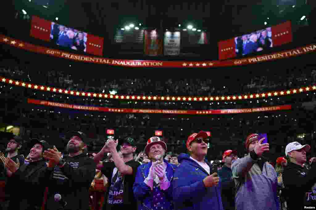 President Donald Trump's supporters applaud inside Capital One arena on the day of an indoor rally on inauguration day in Washington, Jan. 20, 2025.