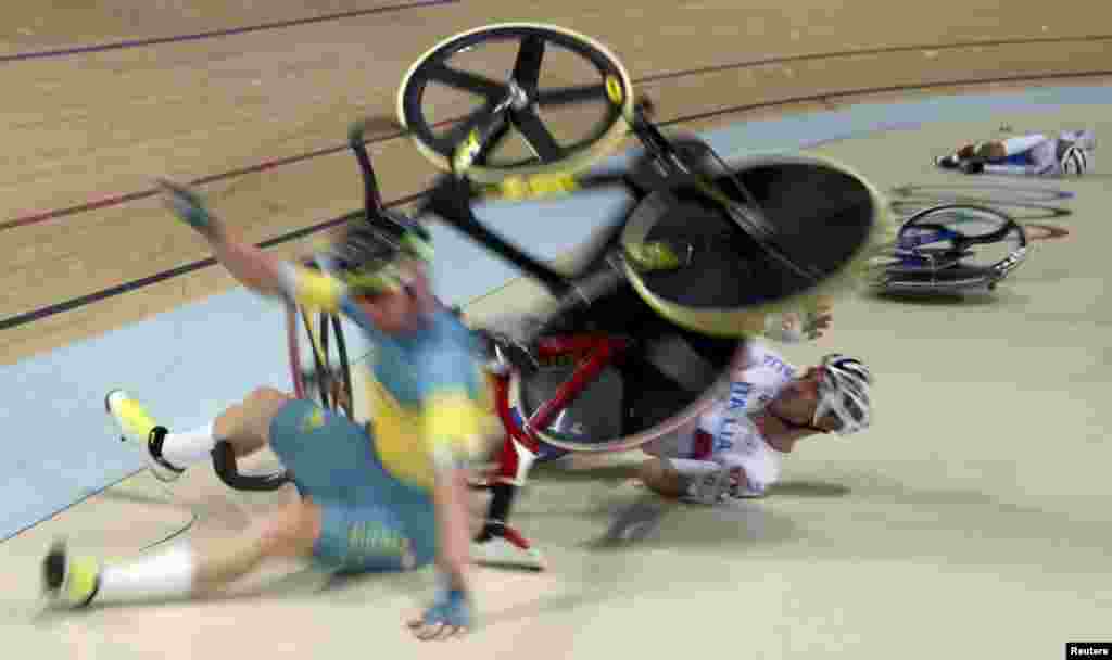 Glenn O'Shea (AUS) of Australia, Elia Viviani (ITA) of Italy and Park Sang-hoon (KOR) of South Korea crash during a cycling event at the Summer Olympics in Rio de Janeiro, Brazil.